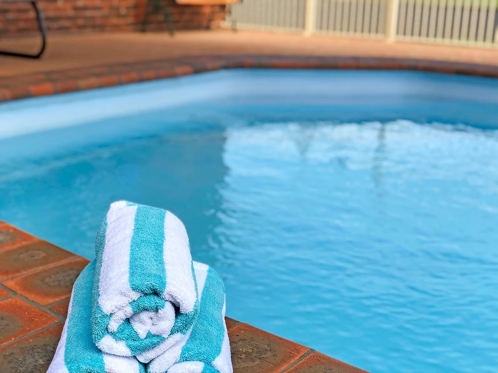 Pool with rolled towels at the Leeton Heritage Motor Inn